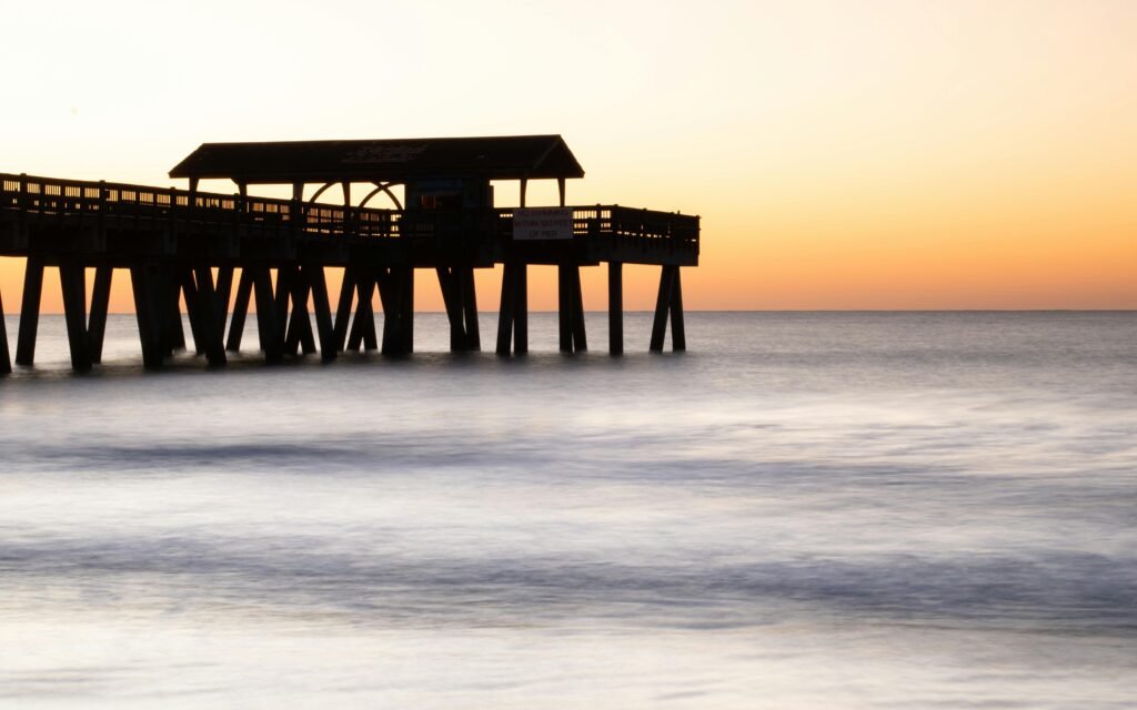 Peaceful sunset at Tybee Island Pier, Georgia capturing serene ocean views.