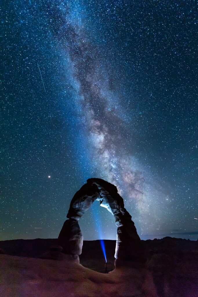 Majestic night view of the Milky Way over Delicate Arch in Utah, USA.