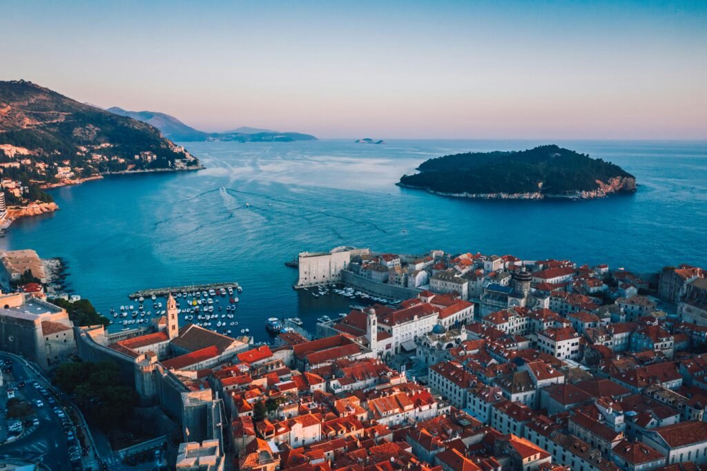 Breathtaking sunset over Dubrovnik's historic cityscape and Adriatic coast.