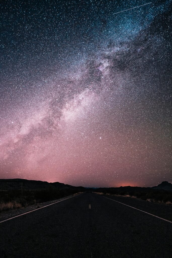 Milky Way stretching across a desert road in Big Bend National Park, TX, USA.